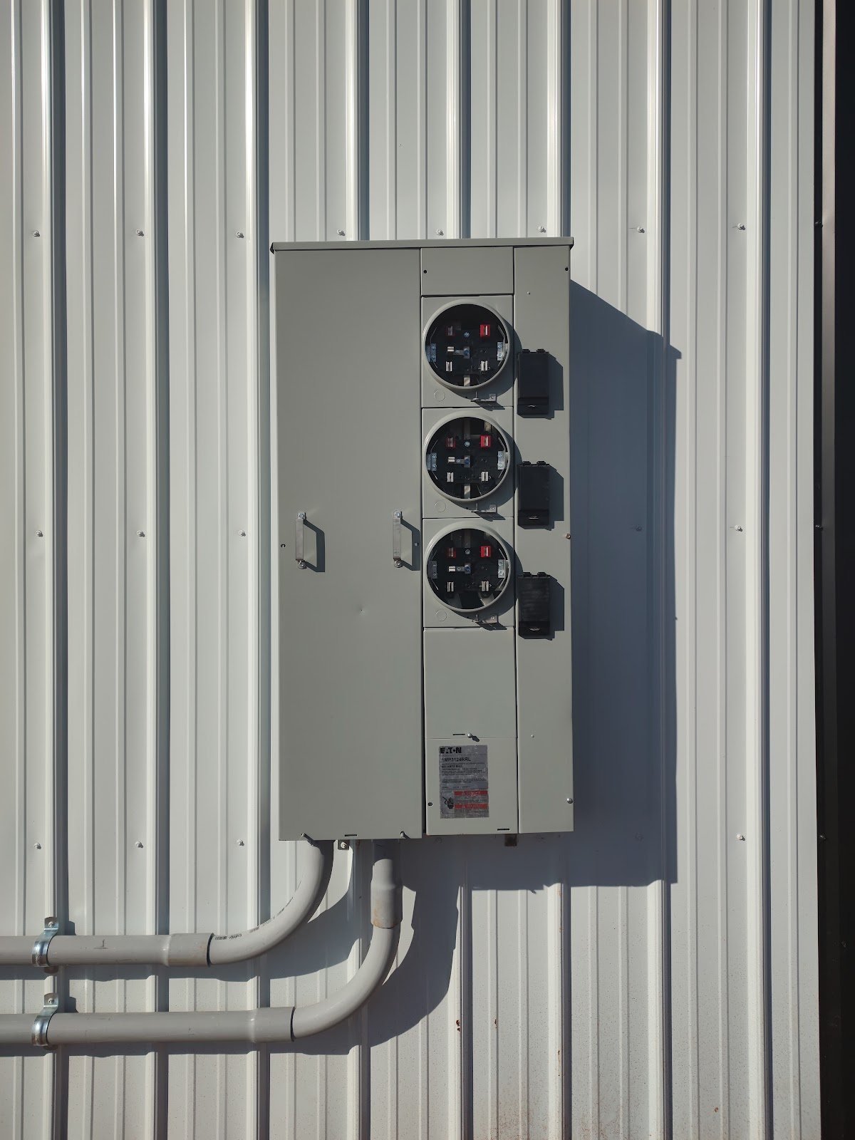 Multi-meter bank installed on a metal building