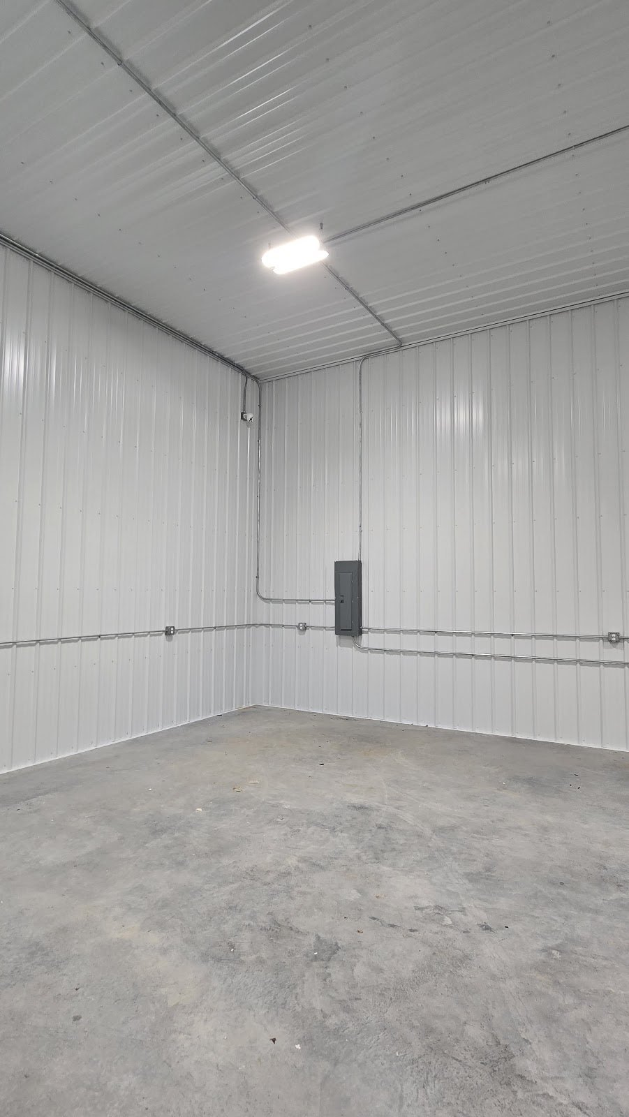Finished shop with LED lighting and conduit runs